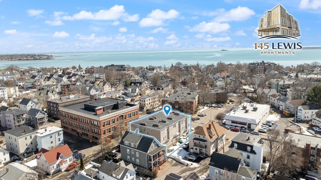 145 Lewis Street Lynn, MA 01902 - Photo 4 of 32 an aerial view of a building with parking space