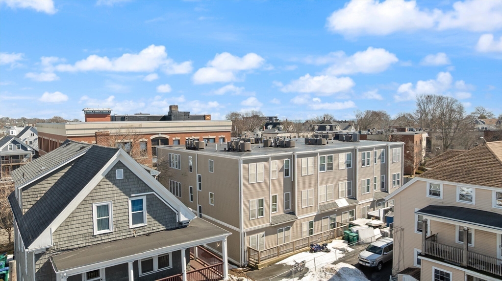 145 Lewis Street Lynn, MA 01902 - Photo 6 of 32 a view of a house with a yard