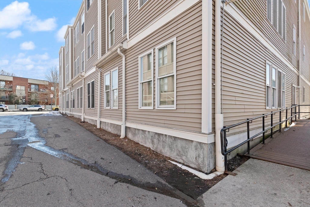 145 Lewis Street Lynn, MA 01902 - Photo 7 of 32 a view of a house with a street