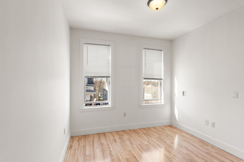 145 Lewis Street Lynn, MA 01902 - Photo 10 of 32 an empty room with windows