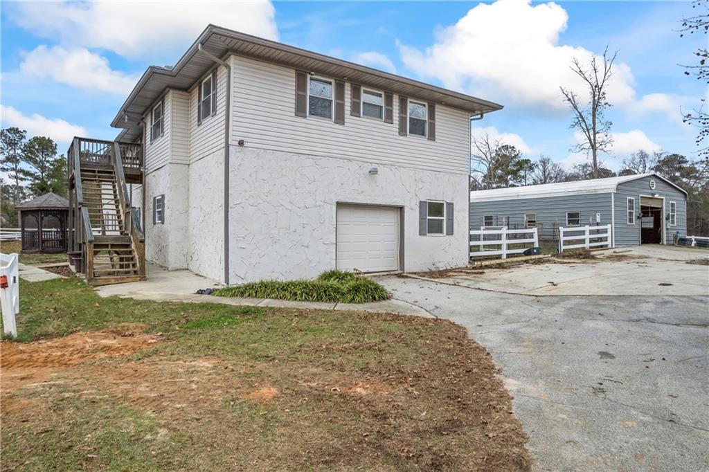 2150 Smyrna Ridge Court Southwest Conyers, GA 30094 - Photo 11 of 125 a front view of a house with a yard