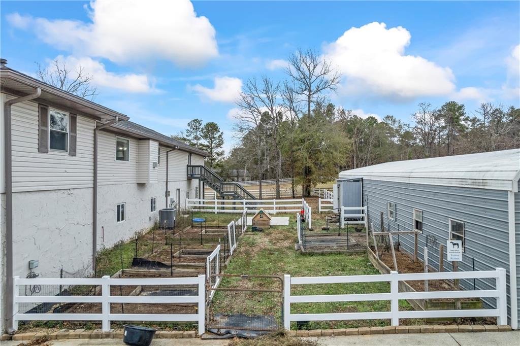 2150 Smyrna Ridge Court Southwest Conyers, GA 30094 - Photo 116 of 125 a view of a house with a yard