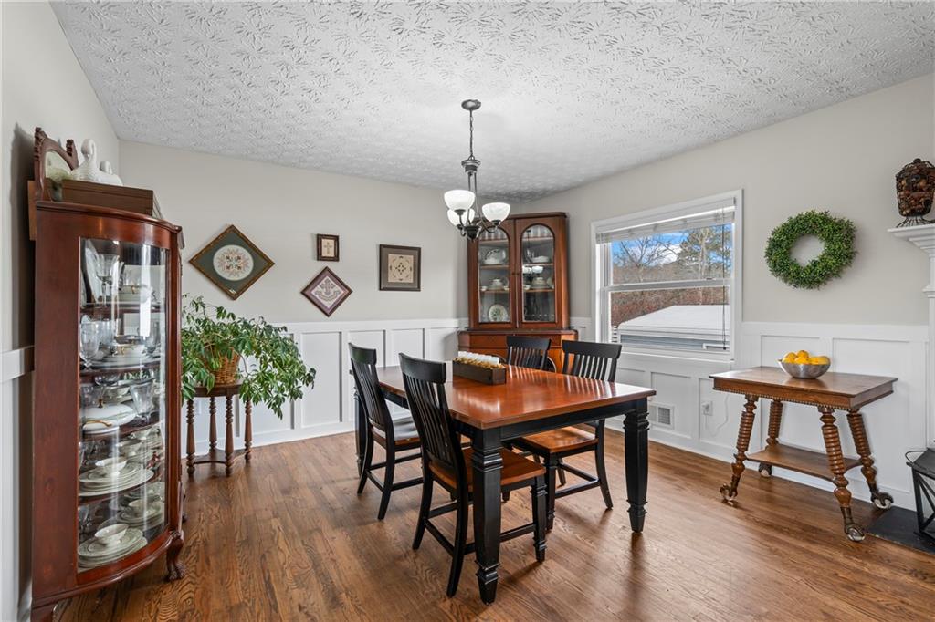 2150 Smyrna Ridge Court Southwest Conyers, GA 30094 - Photo 24 of 125 a view of a dining room with furniture window and wooden floor