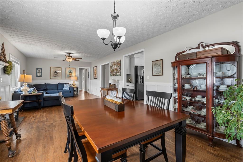 2150 Smyrna Ridge Court Southwest Conyers, GA 30094 - Photo 25 of 125 a view of a dining room with furniture and wooden floor