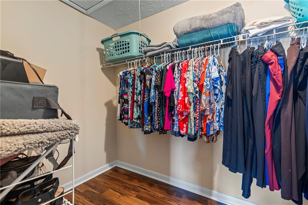 2150 Smyrna Ridge Court Southwest Conyers, GA 30094 - Photo 48 of 125 a view of walk in closet with clothes and shoes