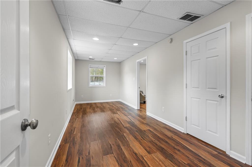 2150 Smyrna Ridge Court Southwest Conyers, GA 30094 - Photo 55 of 125 a view of a hallway with wooden floor and closet