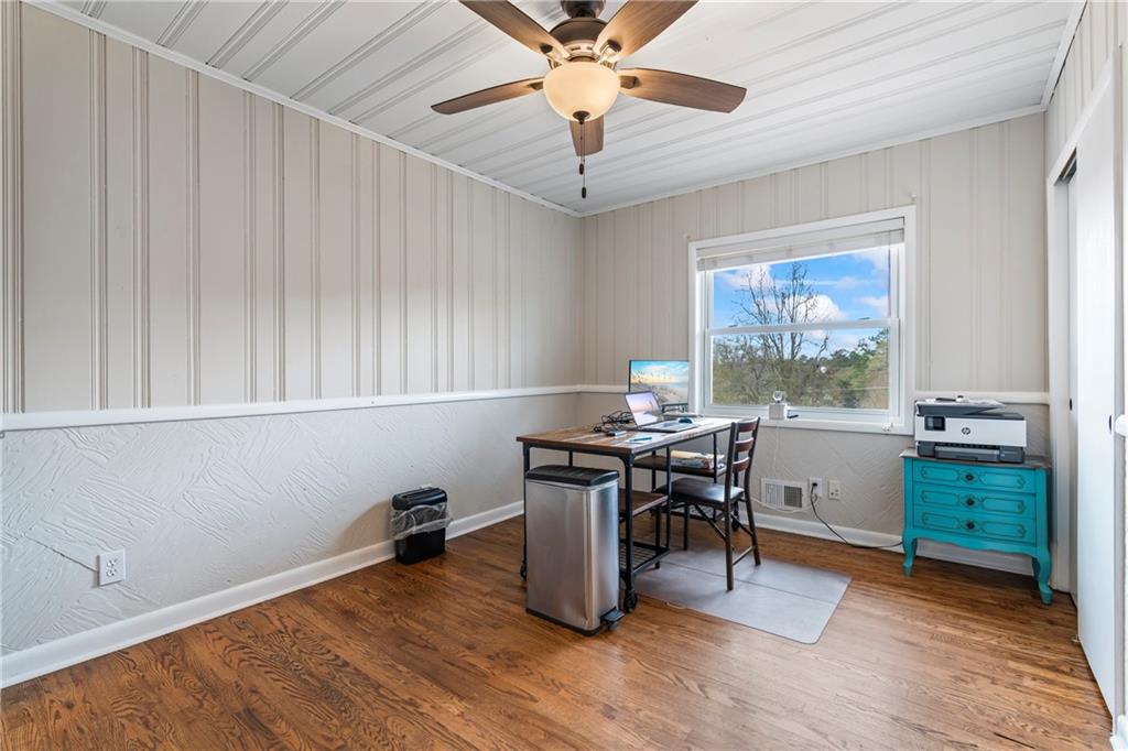 2150 Smyrna Ridge Court Southwest Conyers, GA 30094 - Photo 67 of 125 a workspace with wooden floor and windows
