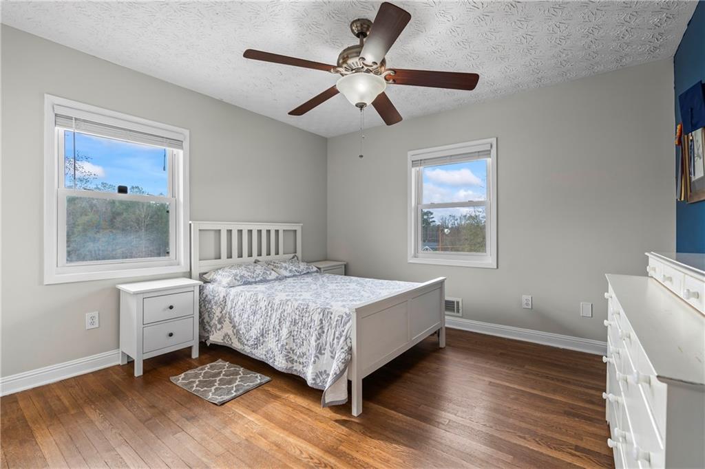 2150 Smyrna Ridge Court Southwest Conyers, GA 30094 - Photo 68 of 125 a bedroom with a bed and a window