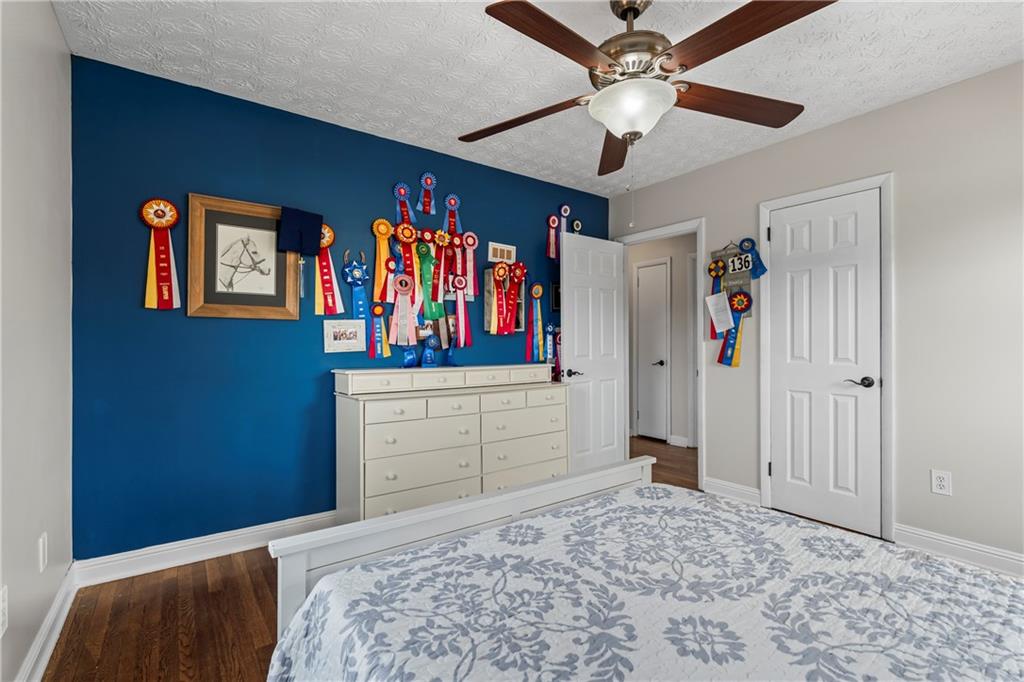 2150 Smyrna Ridge Court Southwest Conyers, GA 30094 - Photo 70 of 125 a bedroom with a bed and a dresser