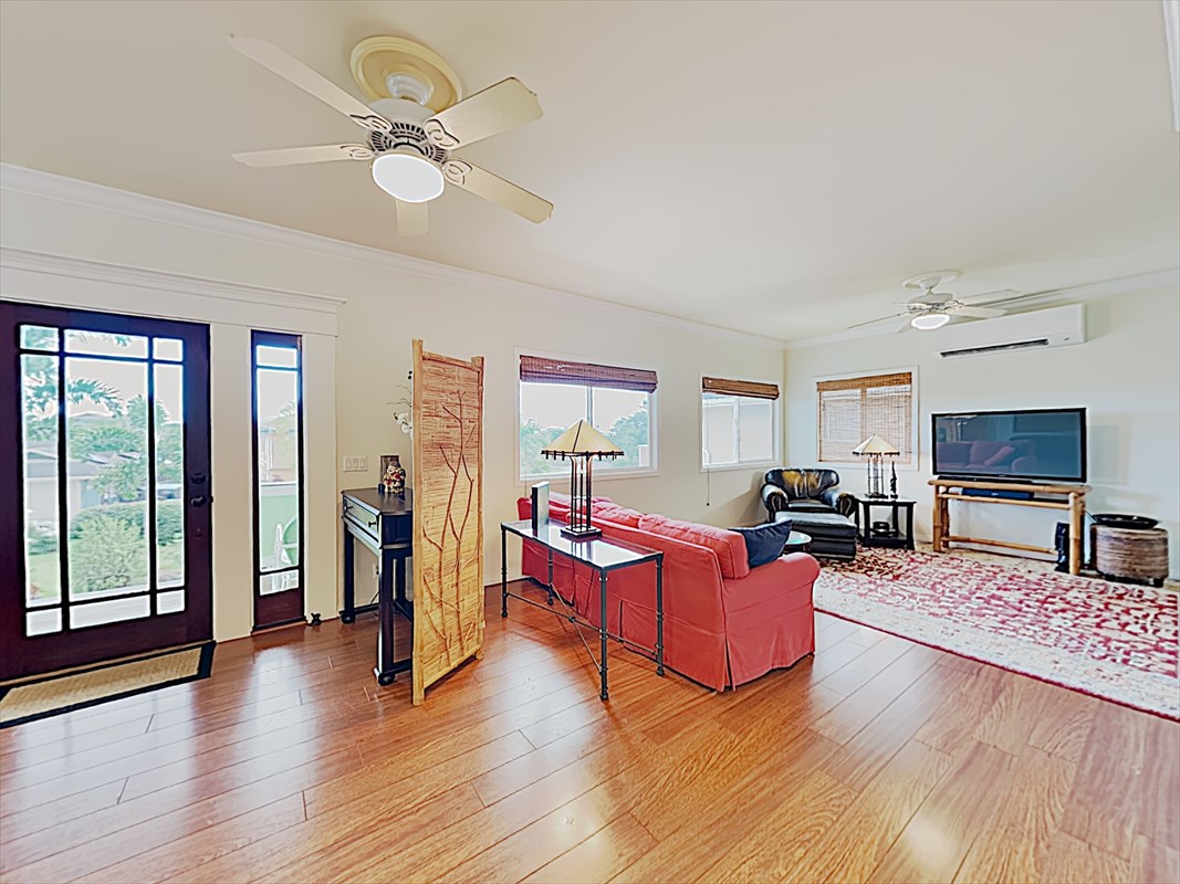 4812 Ohu Road Kapaa, HI 96746 - Photo 7 of 25 a living room with furniture flat screen tv and a large window