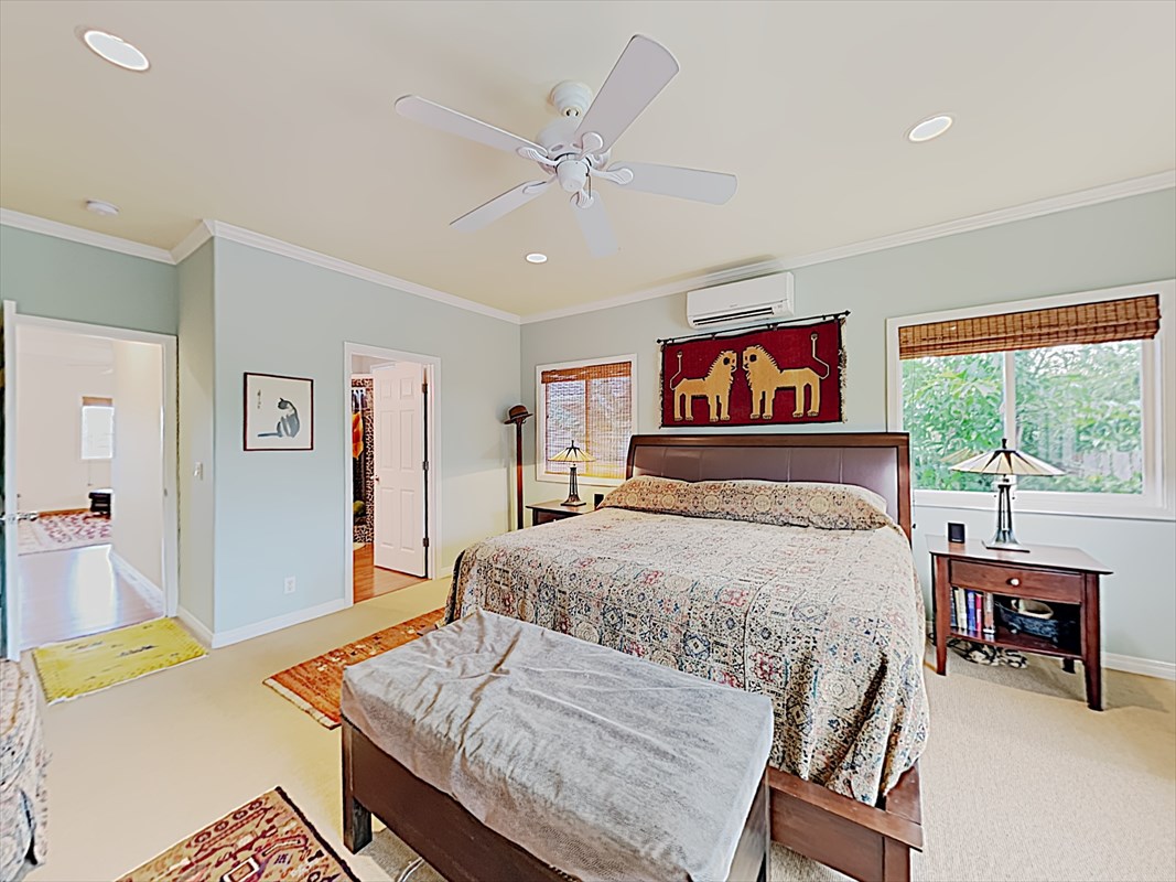 4812 Ohu Road Kapaa, HI 96746 - Photo 9 of 25 a bedroom with a bed and a table