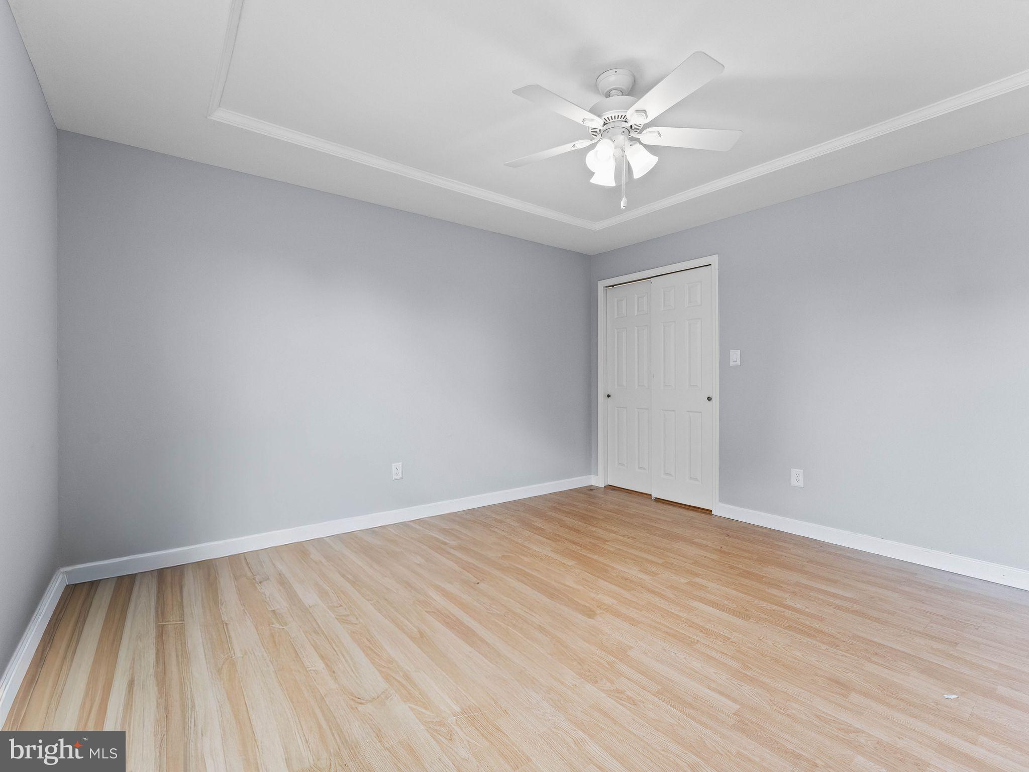 8 Chesterfield Road Sewell, NJ 08080 - Photo 32 of 57 wooden floor in an empty room with a chandelier fan