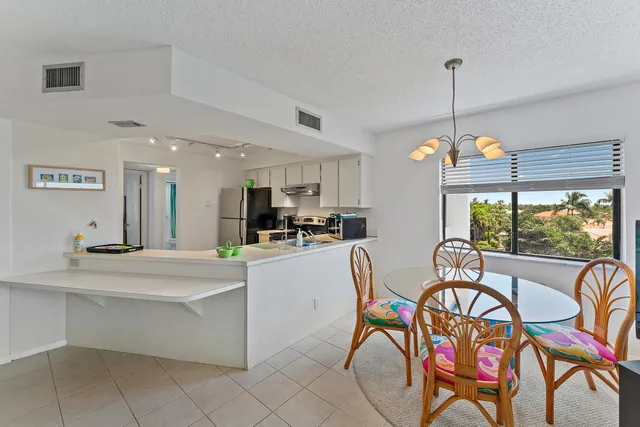 a kitchen with a sink stove and refrigerator