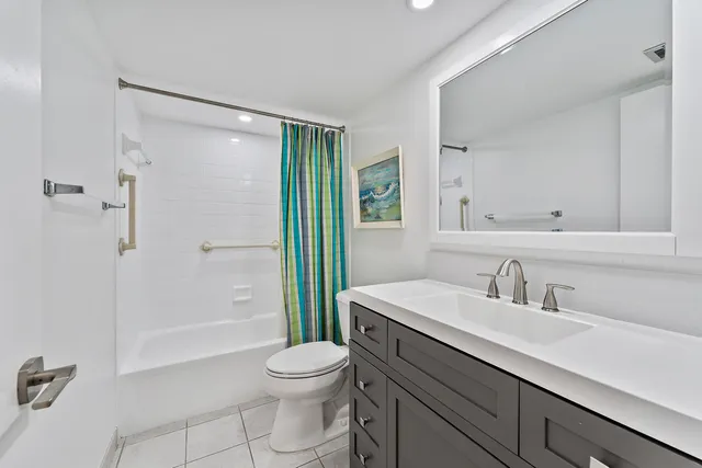 a bed room with a bed and a television