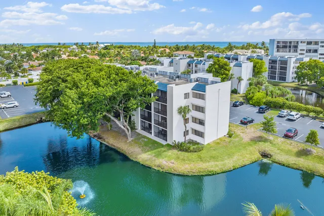 a swimming pool with some trees in the background
