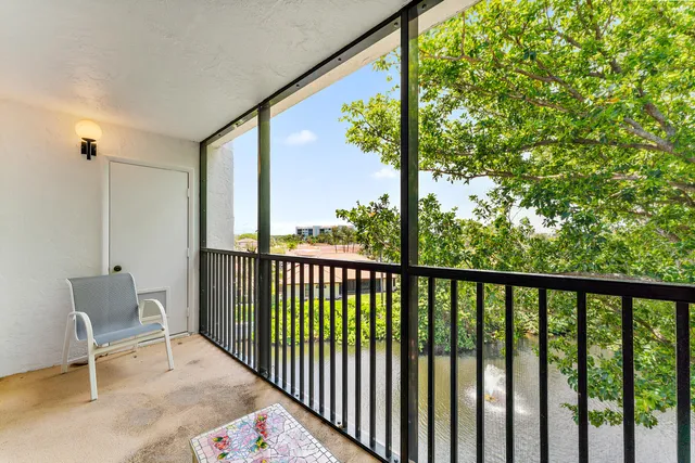 a view of a balcony with furniture