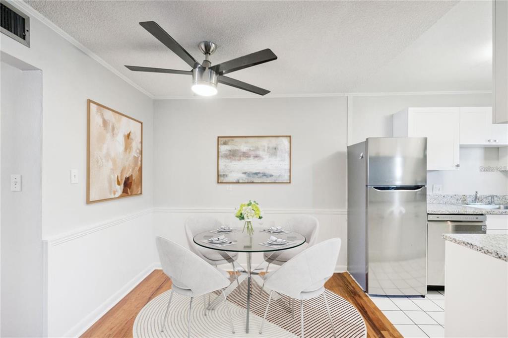 320 Lakeview Street, Unit 213 Orlando, FL 32804 - Photo 8 of 24 a living room with stainless steel appliances furniture a window and a kitchen view