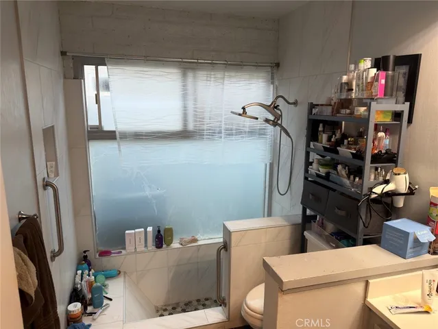 a bathroom with a sink vanity and a mirror