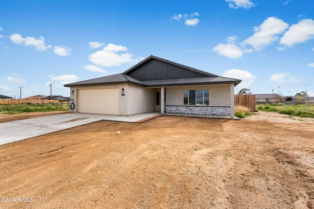 a house view with a swimming pool