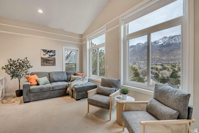 11789 Nicklaus Road Sandy, UT 84092 - Photo 23 of 58 Living room with lofted ceiling, a mountain view, carpet flooring, and recessed lighting