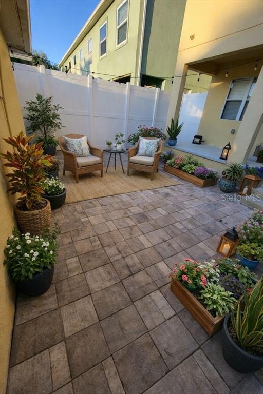 3753 Herlong Street New Port Richey, FL 34655 - Photo 18 of 18 a outdoor space with lots of white furniture