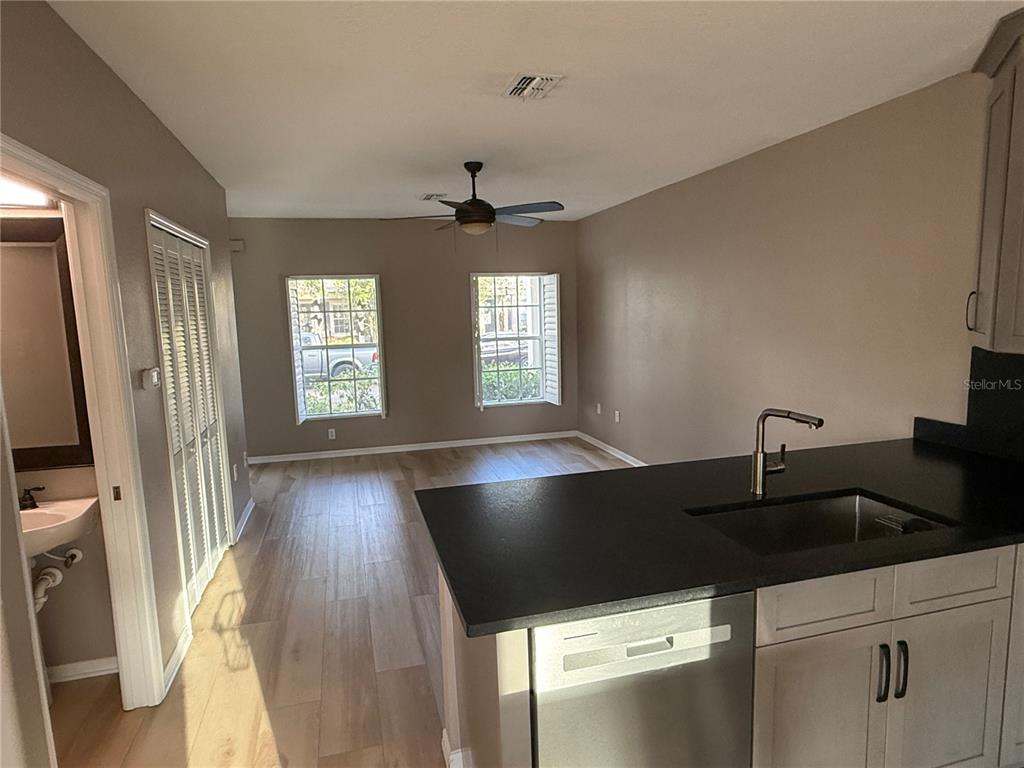 3753 Herlong Street New Port Richey, FL 34655 - Photo 6 of 18 a kitchen with stainless steel appliances a sink a stove and a refrigerator