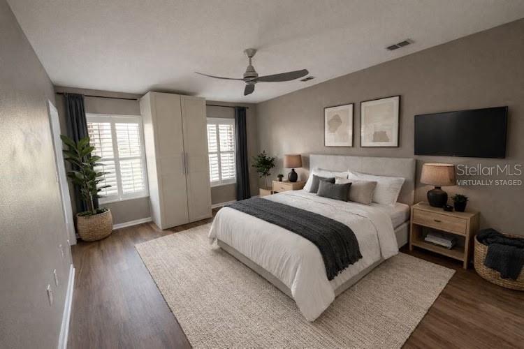 3753 Herlong Street New Port Richey, FL 34655 - Photo 10 of 18 a spacious bedroom with a bed and a flat screen tv