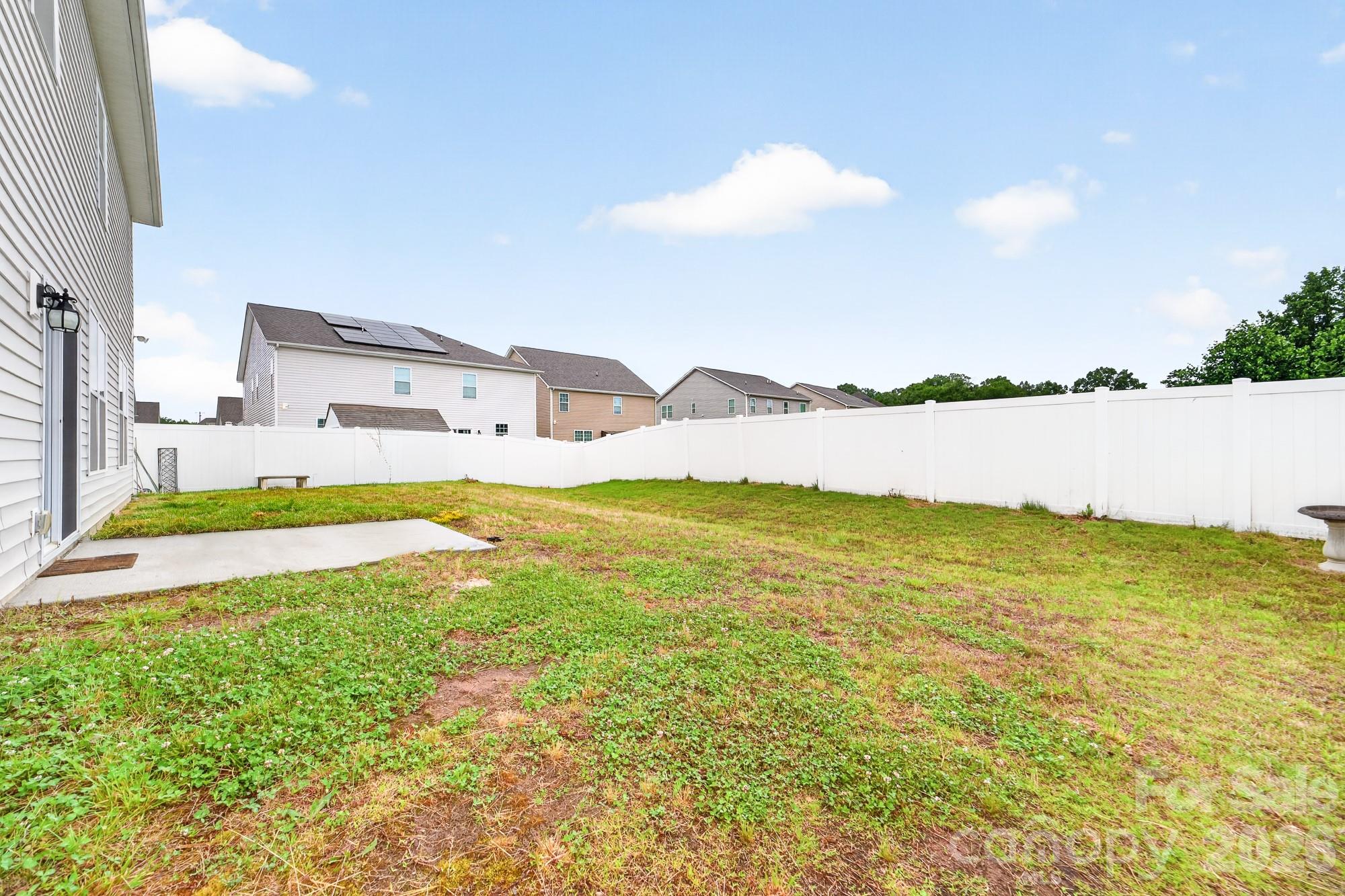 5972 Redwood Pine Road Concord, NC 28027 - Photo 4 of 37 a view of swimming pool with lawn chairs and large trees