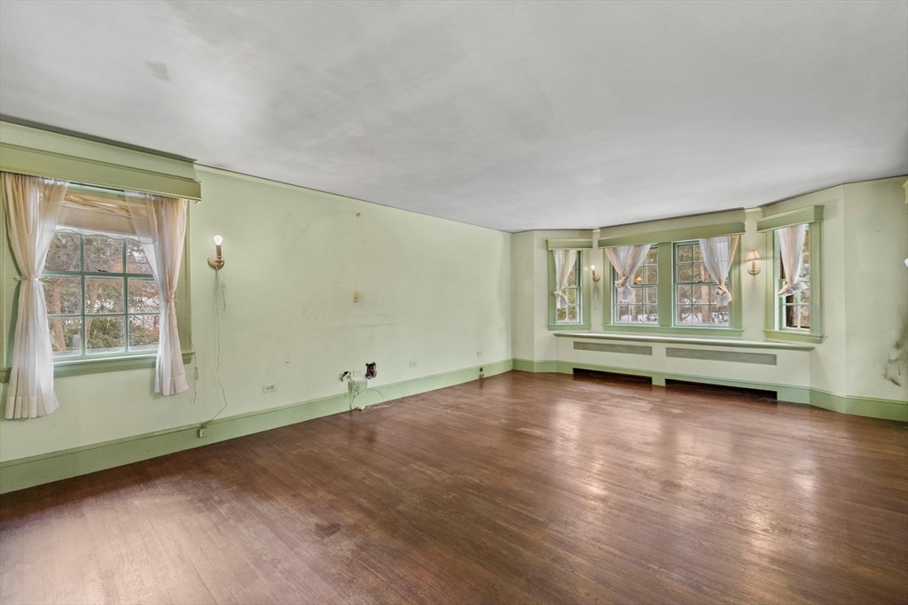 30 Swan Road Winchester, MA 01890 - Photo 22 of 38 an empty room with wooden floor and window