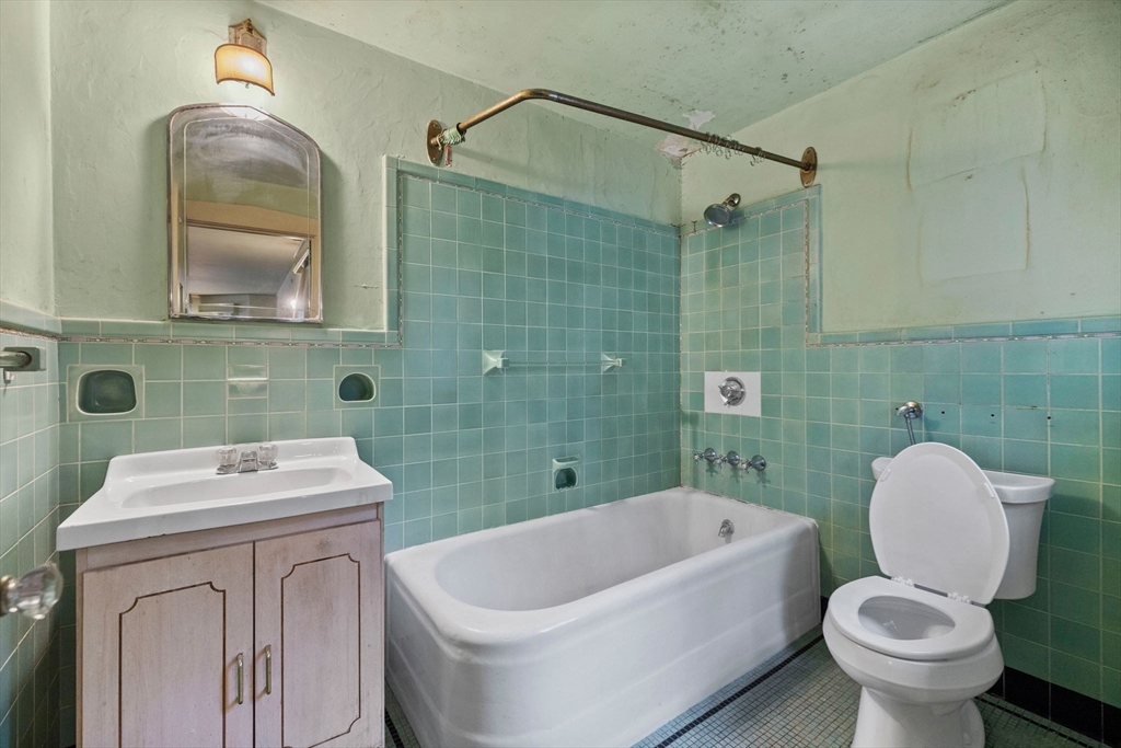 30 Swan Road Winchester, MA 01890 - Photo 24 of 38 a bathroom with a sink toilet and shower