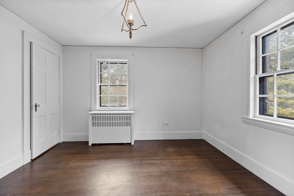 30 Swan Road Winchester, MA 01890 - Photo 27 of 38 an empty room with windows and cabinet