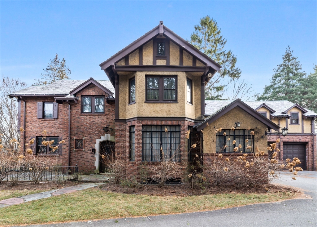 30 Swan Road Winchester, MA 01890 - Photo 3 of 38 a front view of a house with garden