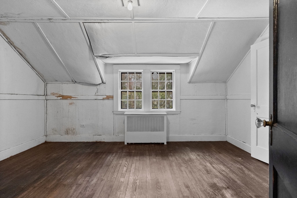 30 Swan Road Winchester, MA 01890 - Photo 32 of 38 an empty room with wooden floor and windows