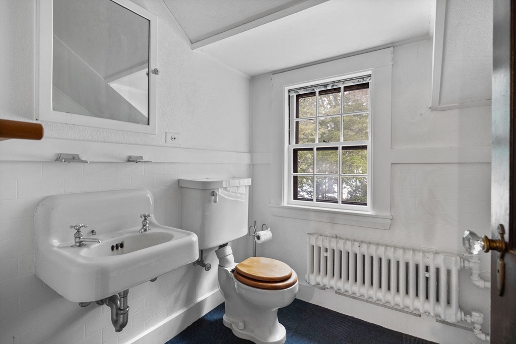 30 Swan Road Winchester, MA 01890 - Photo 35 of 38 a bathroom with a sink and a toilet