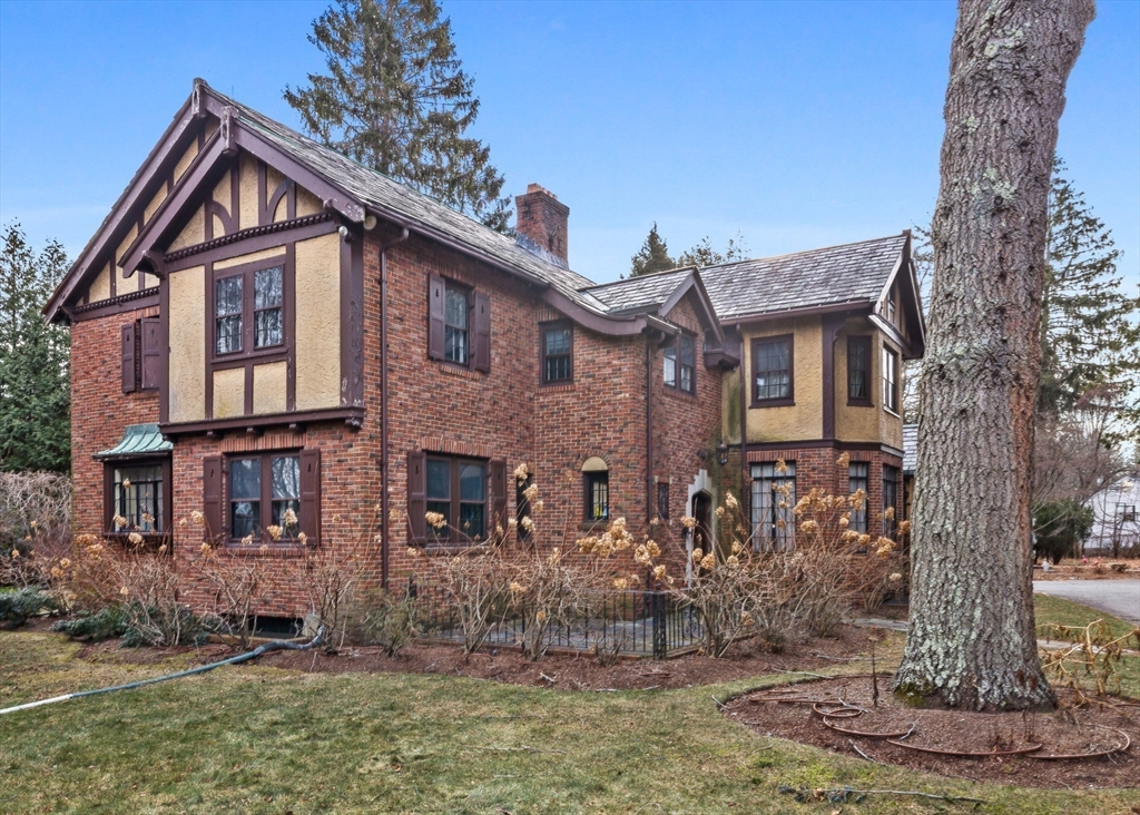 30 Swan Road Winchester, MA 01890 - Photo 4 of 38 a front view of a house with a yard