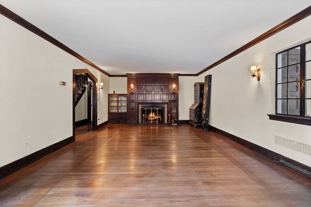 30 Swan Road Winchester, MA 01890 - Photo 6 of 38 a view of a livingroom with wooden floor and a fireplace