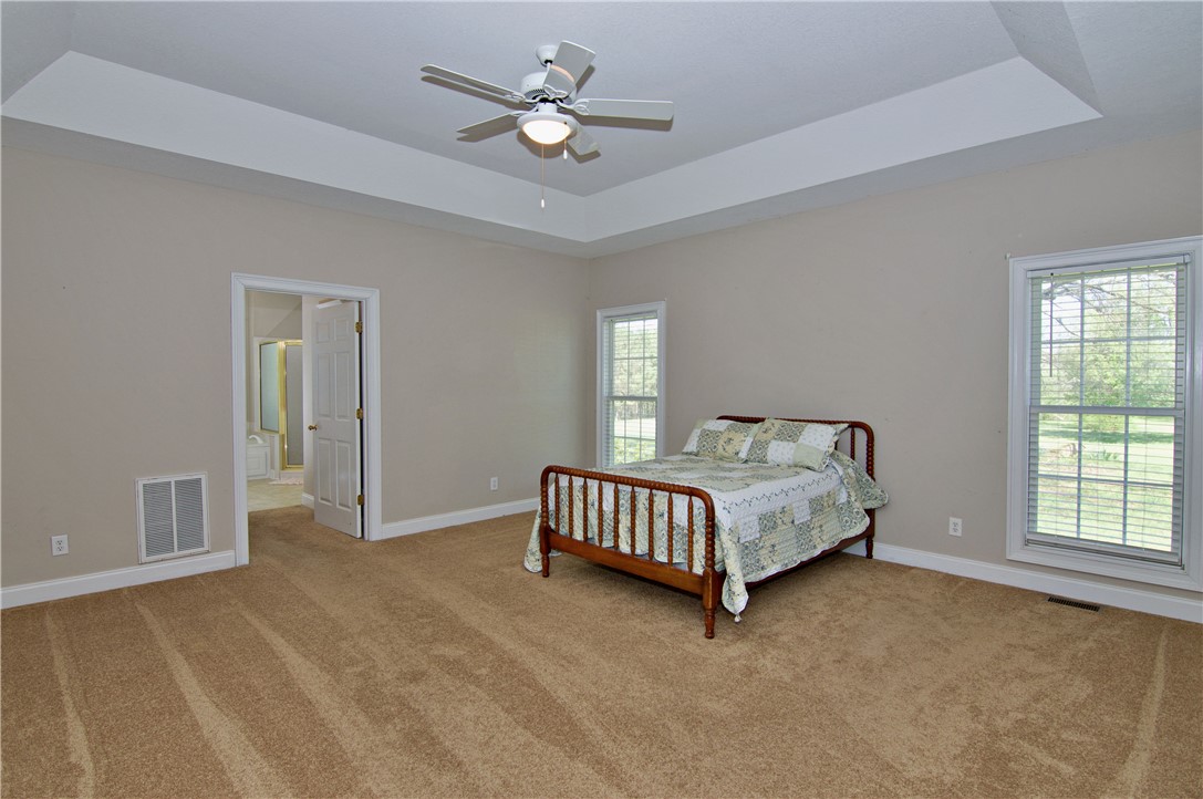 7893 Athens Road Carnesville, GA 30521 - Photo 17 of 50 This spacious bedroom offers ample natural light and a comfortable, inviting atmosphere.