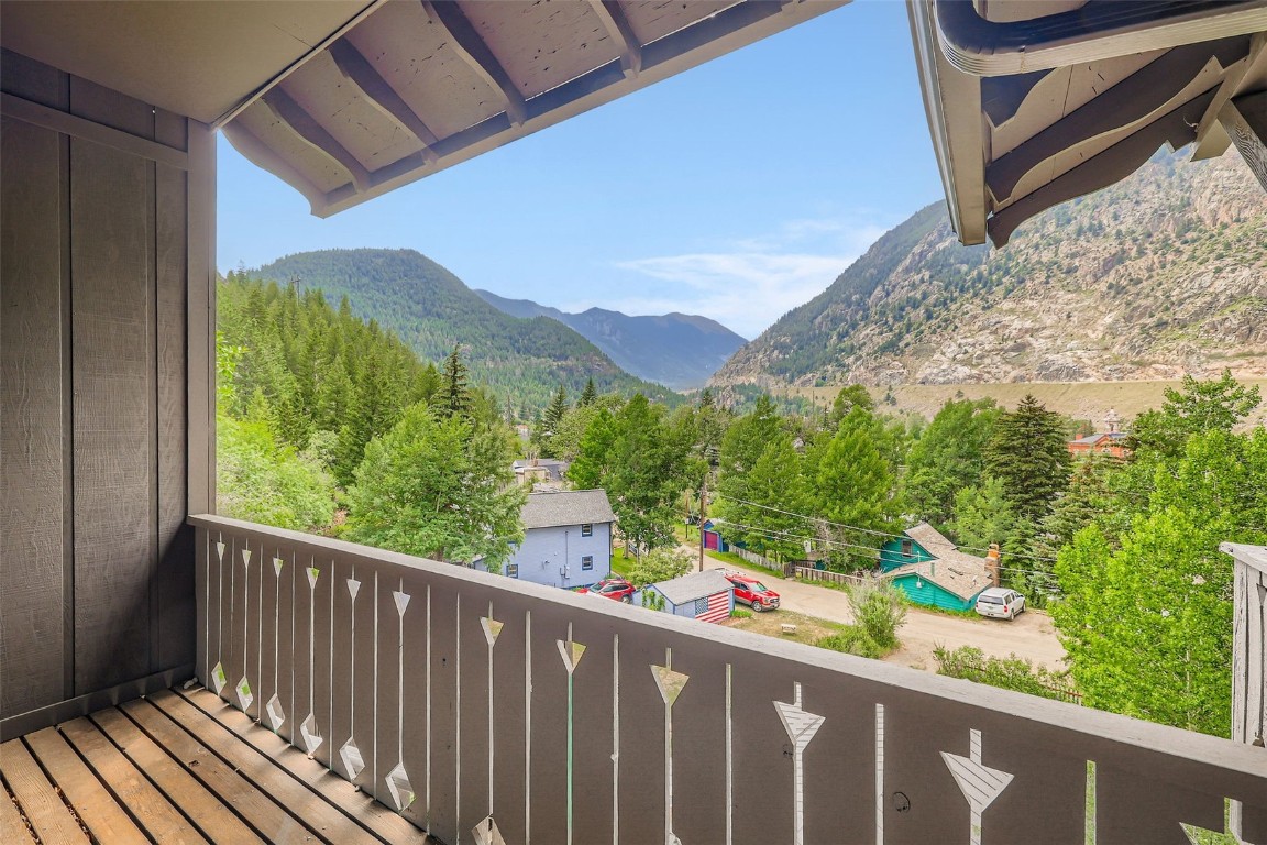 817 Valley View Drive Georgetown, CO 80444 - Photo 2 of 29 a view of a balcony with wooden floor and fence