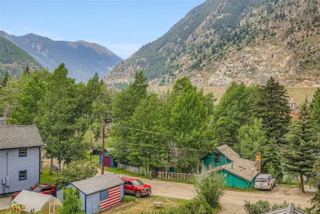 an aerial view of a house with mountain view