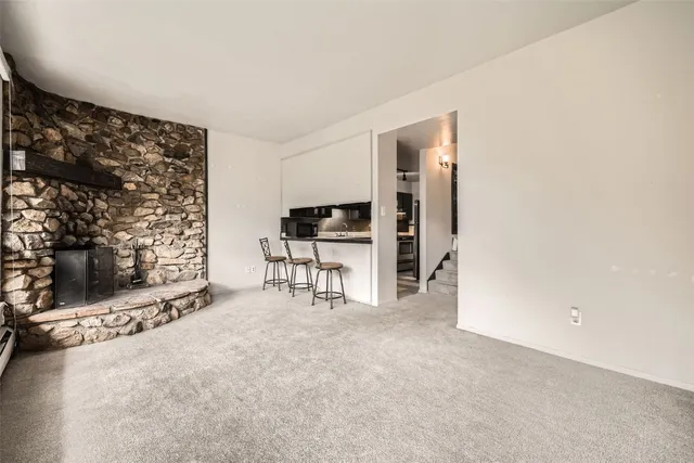 a view of livingroom with furniture and fireplace