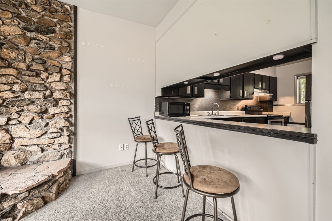 817 Valley View Drive Georgetown, CO 80444 - Photo 5 of 29 a kitchen with a table and chairs in it