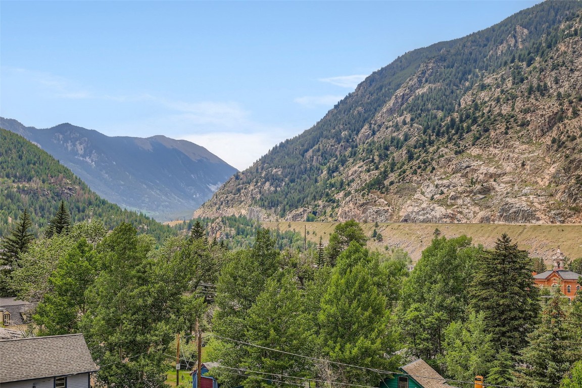 817 Valley View Drive Georgetown, CO 80444 - Photo 7 of 29 a view of a large mountain with a mountain in the background