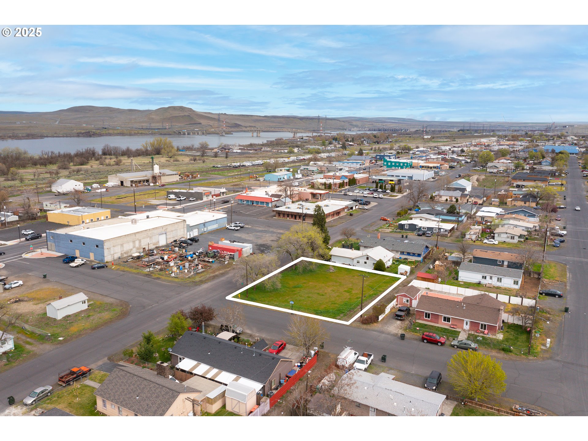 an aerial view of residential houses with outdoor space