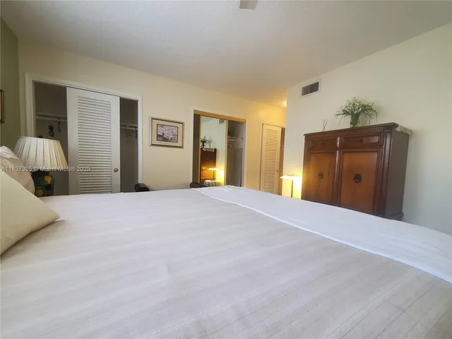 a bedroom with a bed and closet