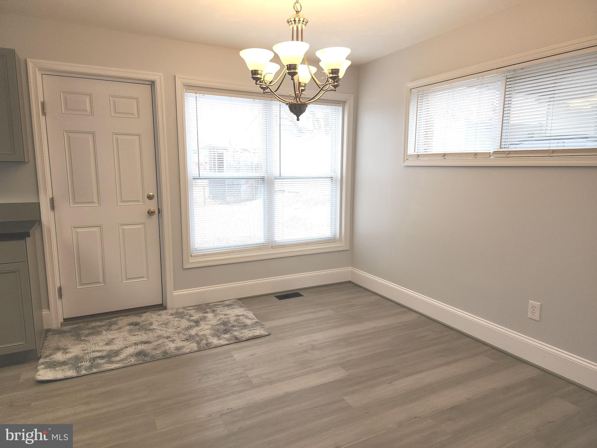 914 Vanderwood Road Catonsville, MD 21228 - Photo 6 of 23 a view of an empty room with a window