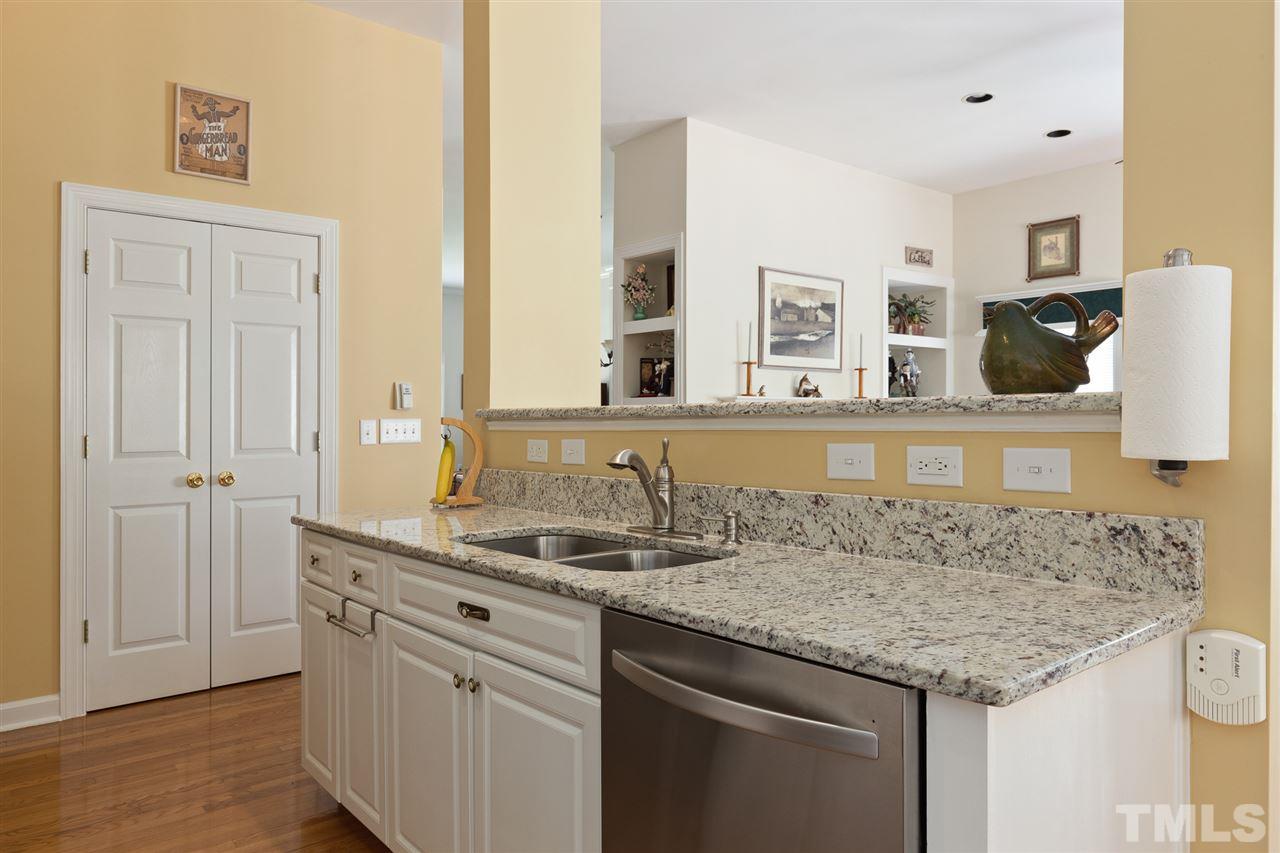 4008 Batiste Road Raleigh, NC 27613 - Photo 12 of 24 a bathroom with a granite countertop sink and a mirror