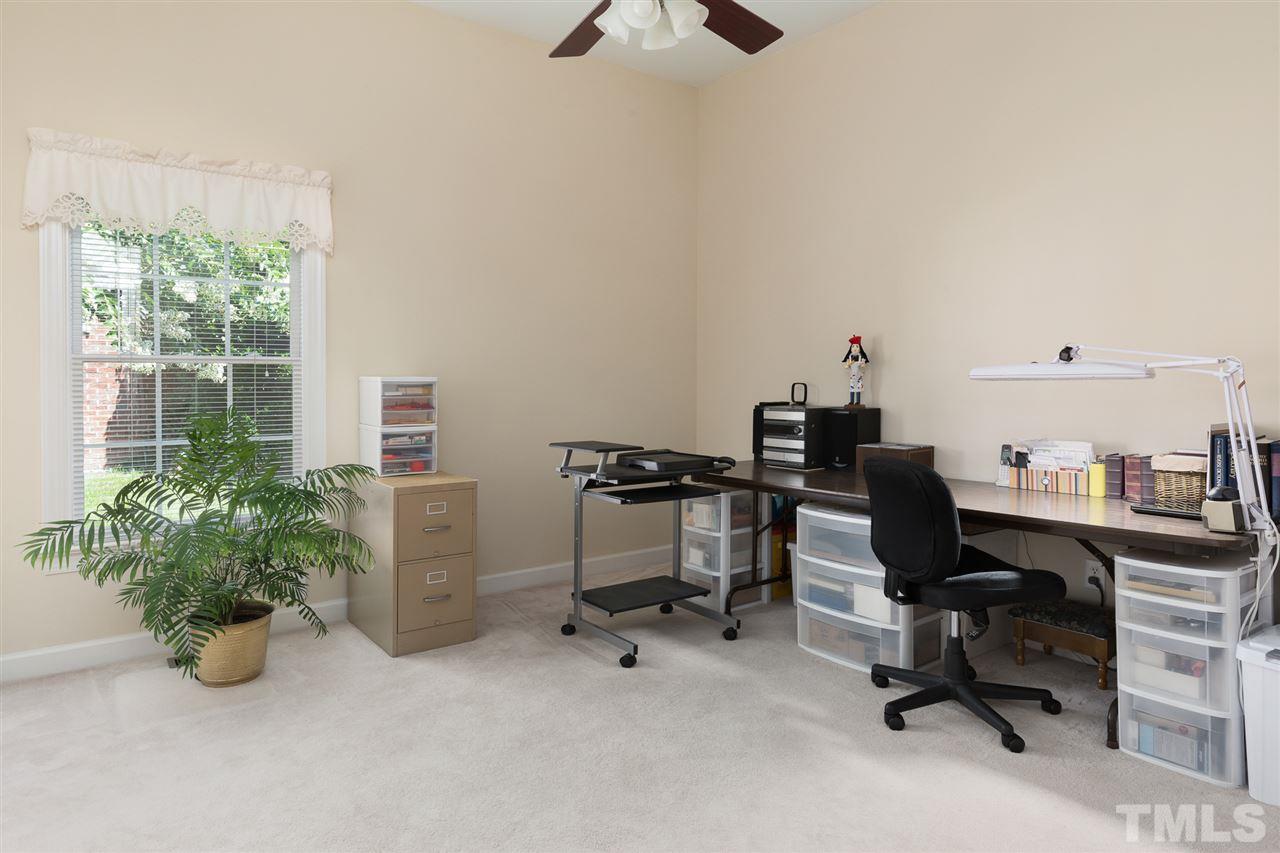 4008 Batiste Road Raleigh, NC 27613 - Photo 18 of 24 a view of a workspace with furniture and a window