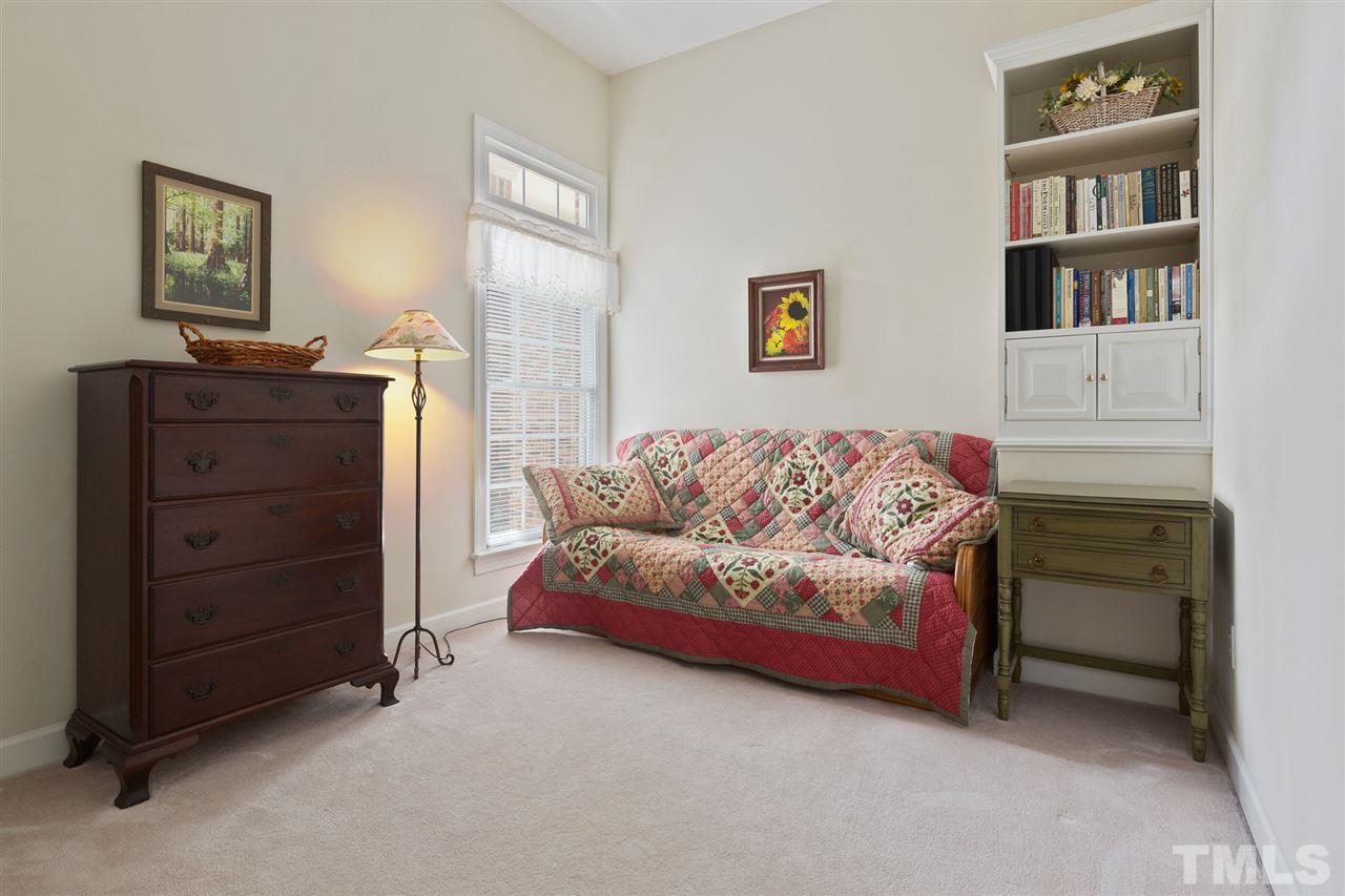 4008 Batiste Road Raleigh, NC 27613 - Photo 19 of 24 a living room with furniture and a dresser