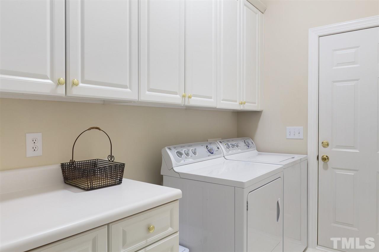 4008 Batiste Road Raleigh, NC 27613 - Photo 21 of 24 a utility room with dryer and washer