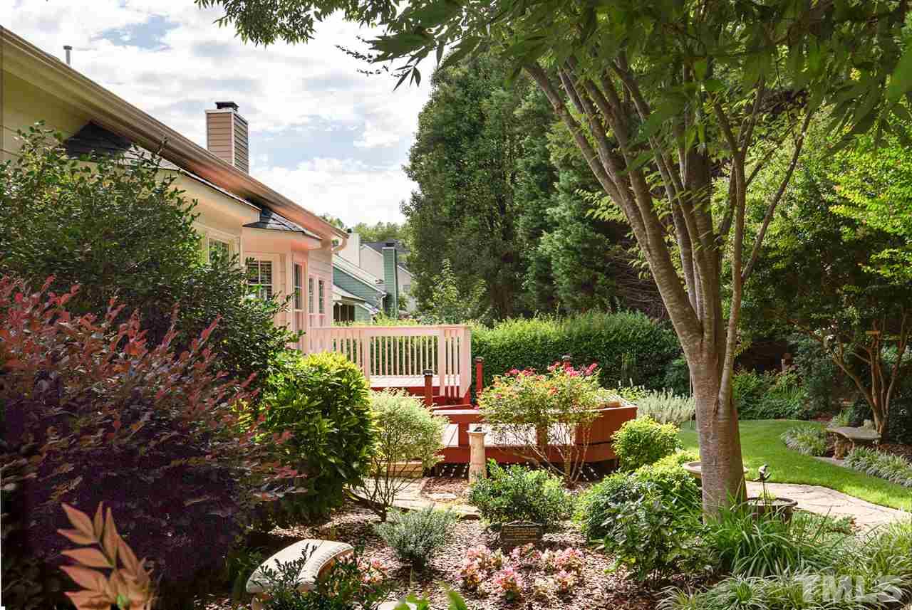 4008 Batiste Road Raleigh, NC 27613 - Photo 22 of 24 a view of a chair and table in the backyard